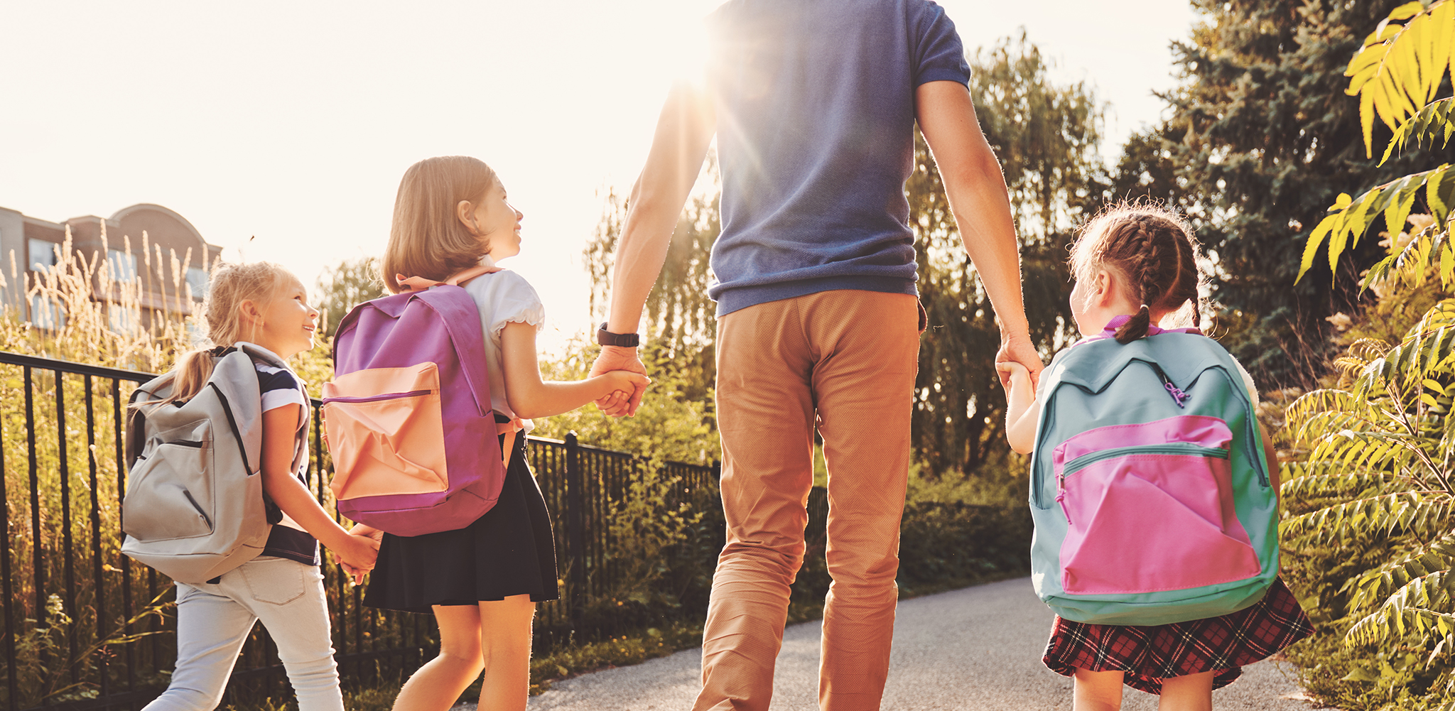 dad walking kids to school