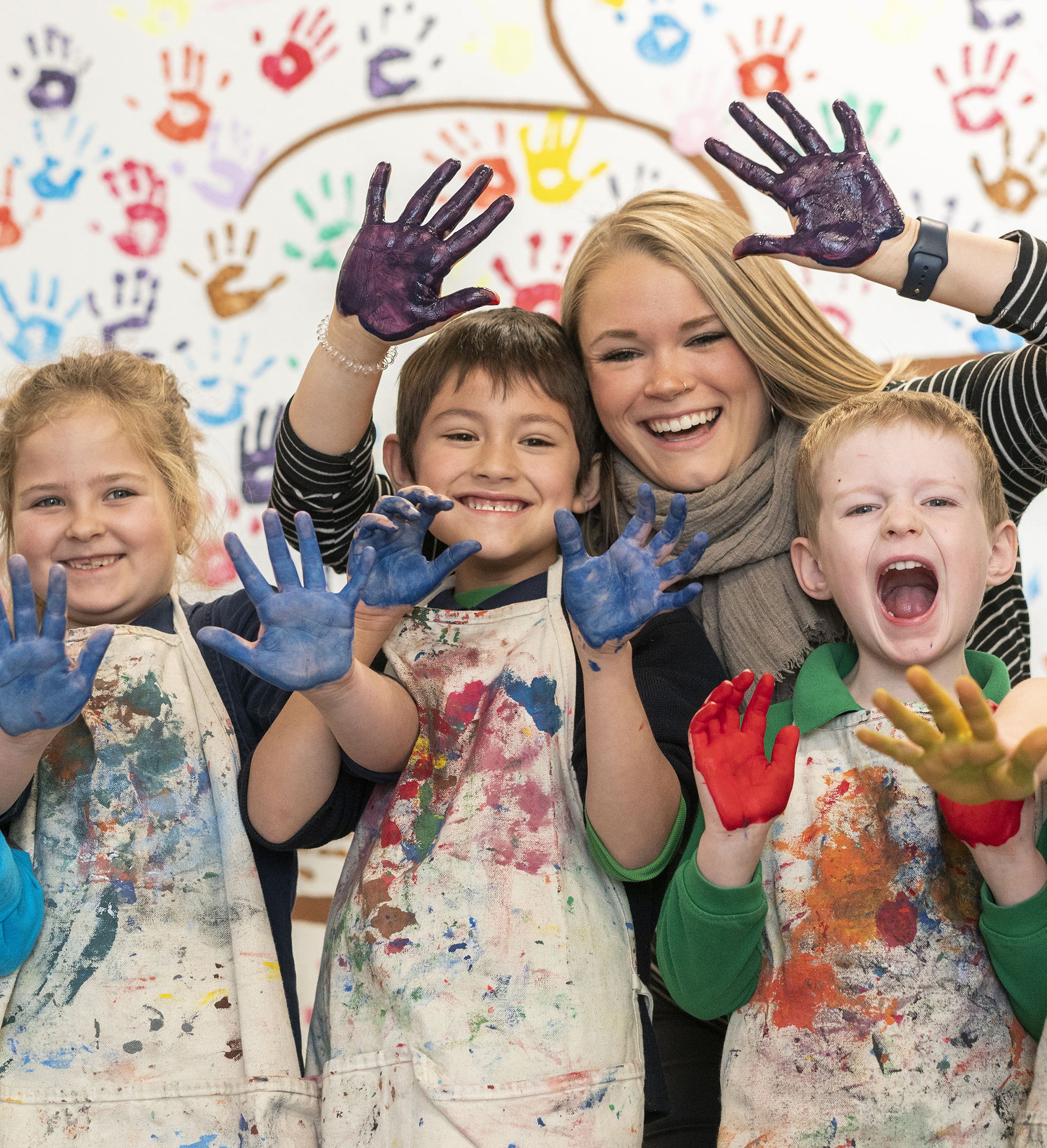 teacher and kids painting